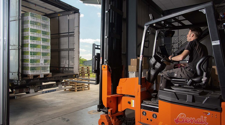 Photography of a man driving a forlift